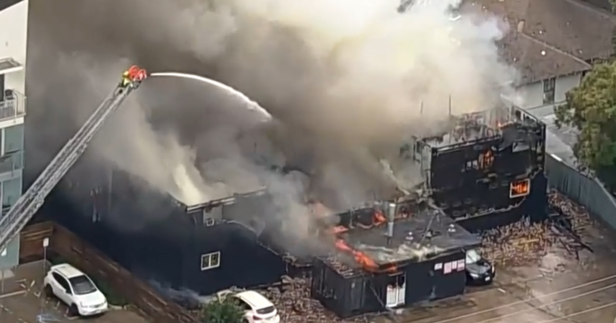 Nearly 100 firefighters battling major apartment fire, possible explosion in Dallas