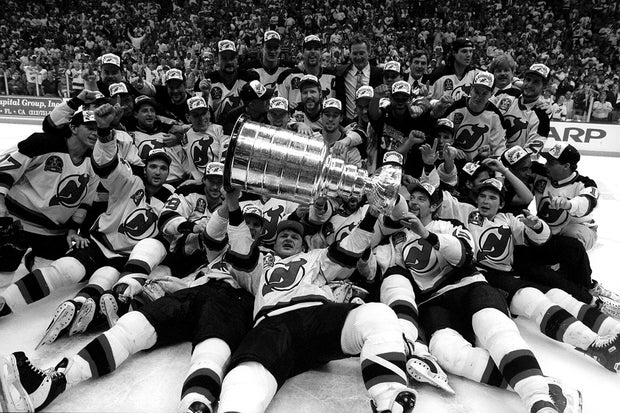 Devils team picture as Claude Lemieux , the MVP, holds the S 