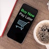 High Angle View of Smartphone with Text Buy Now Pay Later Shopping 