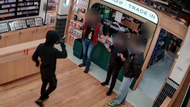 Man points gun at Pok&eacute;mon trading card store employee 