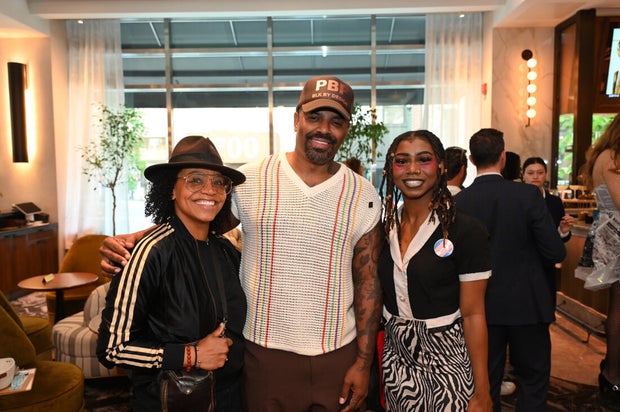 People post for photos at a Pride event at Sofitel Hotel in Philadelphia 
