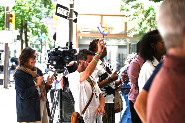 People post for photos at a Pride event at Sofitel Hotel in Philadelphia 