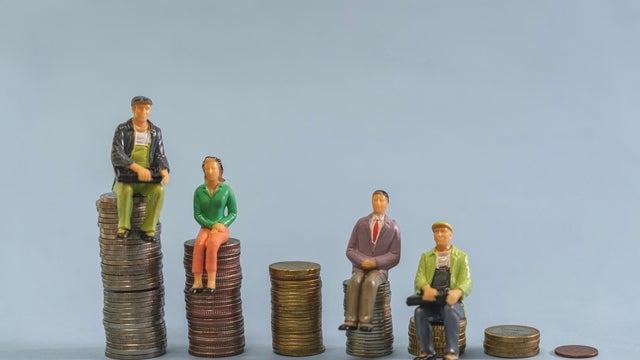 Elderly people sitting on coin, Time counting down for retirement concept, social security income and pensions 