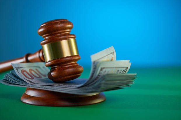 Close-up of gavel on table