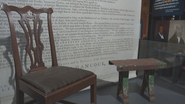 A chair and a small bench at the Museum of the American Revolution 