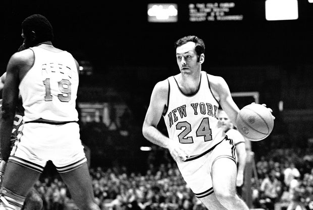 Bill Bradley, #24, Forward, of the New York Knicks, drives toward the basket as Willis Reed, Center, #19 sets a pick against the Buffalo Braves during an NBA basketball game in Madison Square Garden, New York, N.Y. , October 16, 1973.