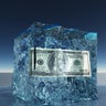 One hundred dollar bill frozen in ice 