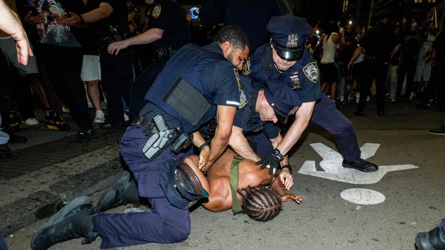 New York Knicks fans are detained by NYPD as they run around Midtown during Game 4 of the NBA Finals between New York Knicks and San Antonio Spurs, on June 10, 2026 in New York City. 