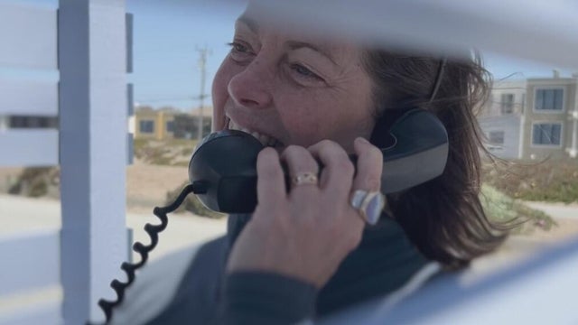 a woman talking on a phone 