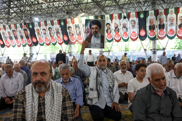 People attend Friday prayer in Tehran 