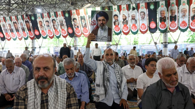People attend Friday prayer in Tehran 