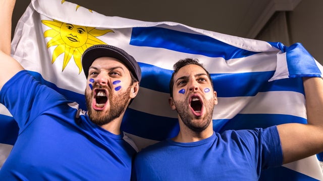 Uruguayan fans holding the national flag 
