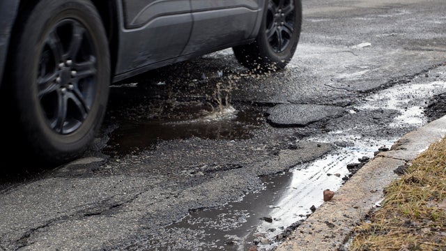 Car collides with large pothole 