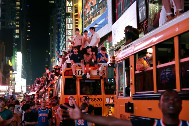 New York Knicks fans celebrate their victory after Game 5 of the NBA Finals basketball series against the San Antonio Spurs, Saturday, June 13, 2026, in New York.