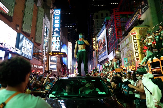 New York Knicks fans celebrate their victory after Game 5 of the NBA Finals basketball series against the San Antonio Spurs, Saturday, June 13, 2026, in New York.