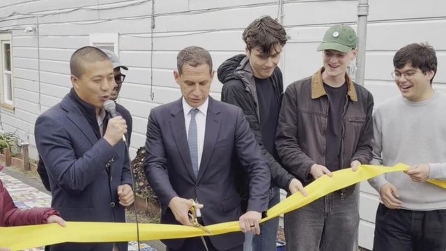 an unveiling ceremony for an art installation 