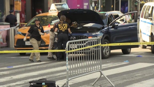 Police examine a vehicle in Times Square