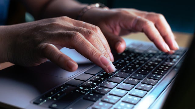 hacker or programmer hand using laptop 