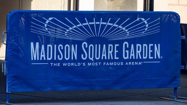 Crowd outside Madison Square Garden entrance at night, Seventh Avenue, Manhattan, New York City, New York, USA 