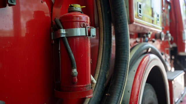 Firemen equipment on fire truck,Fire engine with equipment stay in the fire department. 