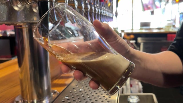 Red wine being poured in a glass 