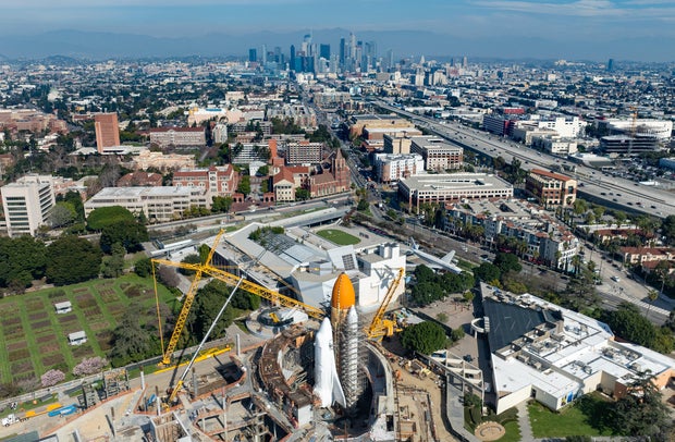 The space shuttle Endeavour is wrapped in protective shrink wrap