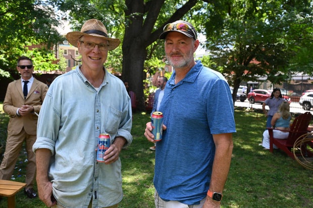 People pose for photos at City Tavern Garden 