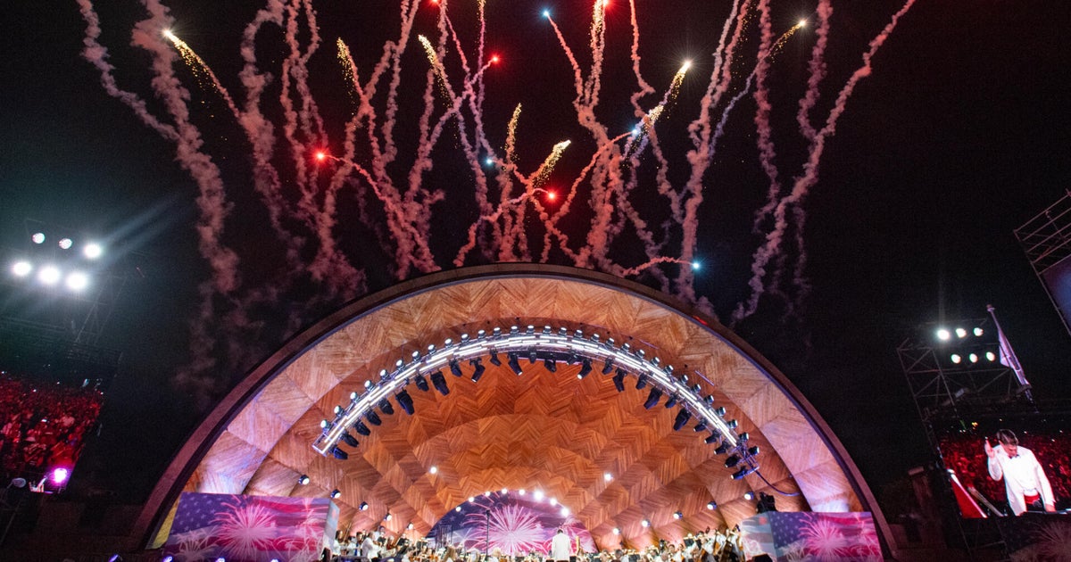 Crowds gather for the Boston Pops Fourth of July celebration on the Charles River Esplanade
