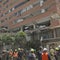 Rescuers in Venezuela race to save security guard trapped under building