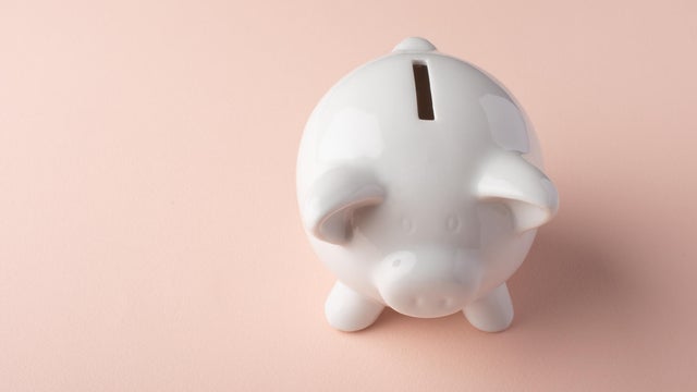 Gilt piggy bank on a light background. Money saving concept. Saving. view from above 