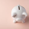 Gilt piggy bank on a light background. Money saving concept. Saving. view from above 