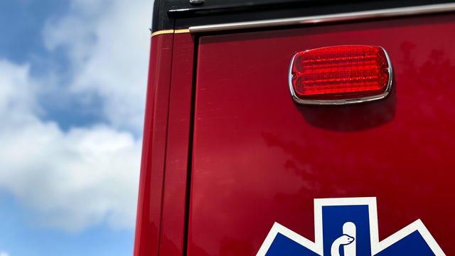 top of ambulance with emergency light & universal medical symbol in view 