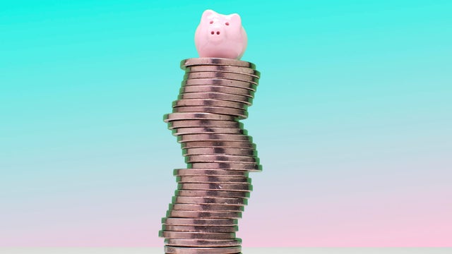 Savings concept - Piggy bank on US nickel coins 