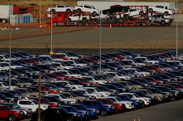 FILE PHOTO: Newly assembled vehicles are seen at a stockyard of the automobile plant Toyota Motor Manufacturing of Baja California in Tijuana, Mexico
