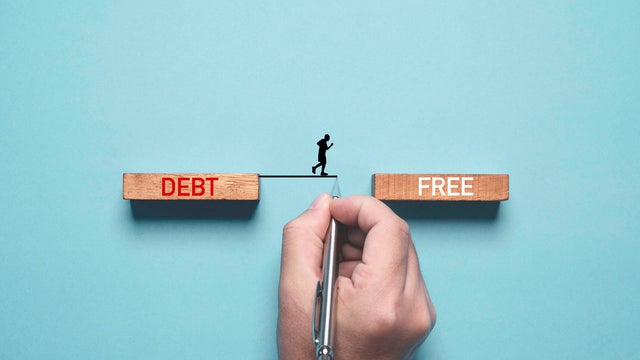 Hand writing line to connect between deb and free wording for solving business consumer burden financial debt or borrow mortgage failure crisis concept. 