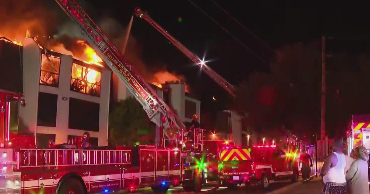 Dozens displaced after fire destroys Dallas condominium, officials say