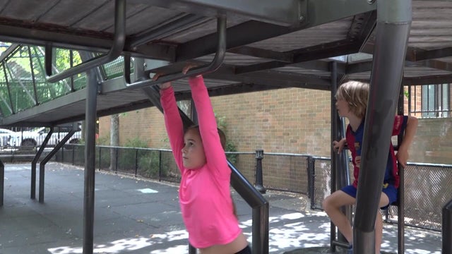 Two children playing on playground 
