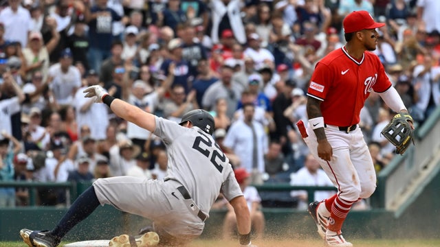 New York Yankees' Ben Rice, left, slides into third base for a two-run RBI triple as Washington Nationals third baseman Jorbit Vivas, right, waits a the throw during the eighth inning of a baseball game, Sunday July 12, 2026, in Washington. 