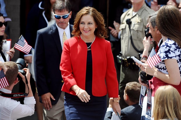 Darline Graham Nordone, sister of Sen. Lindsey Graham, walks to the stage before the announcement of his presidential campaign on June 1, 2015, in Central, South Carolina.
