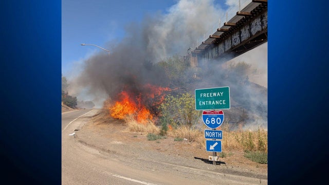 A brush fire on the side of Interstate 680 