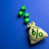 Money bag with interest and blocks with dollar symbols Concept of deposits and loans Earn on deposits Dividends 