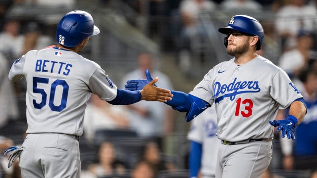 Max Muncy #13 of the Los Angeles Dodgers celebrates with teammate Mookie Betts #50 after hitting a home run in the seventh inning during the game between the Los Angeles Dodgers and the New York Yankees at Yankee Stadium on Friday, July 17, 2026 in New York, New York. 