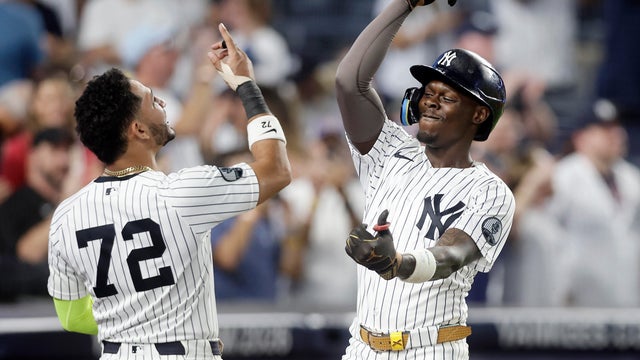 Jazz Chisholm Jr. #13 of the New York Yankees celebrates his eighth inning home run against the Los Angeles Dodgers with teammate Jose Caballero #72 in game two of a doubleheader at Yankee Stadium on July 19, 2026 in New York City. 