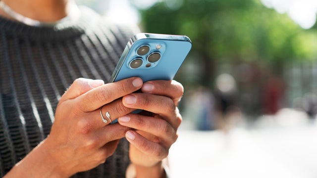 Close up of woman using smart phone 