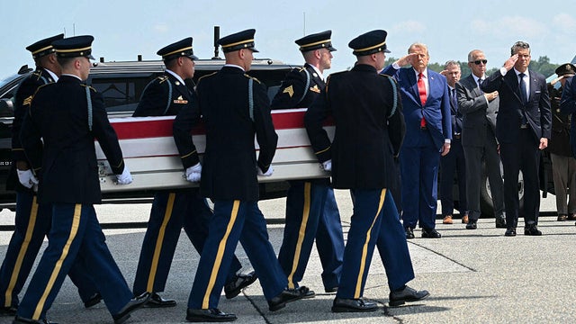 President Trump and Defense Secretary Pete Hegseth salute during a dignified transfer for Sgt. Angel S. Rampersad at Dover Air Force Base in Dover, Delaware, on July 22, 2026. 