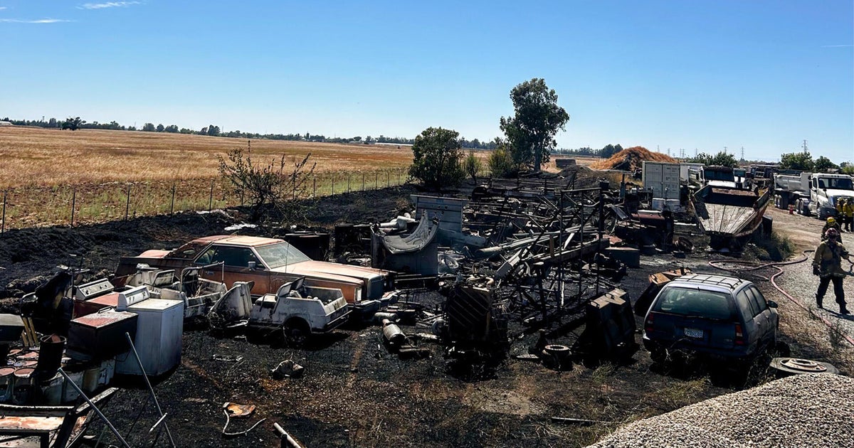 Sacramento County grass fire spreads into truck yard, damages vehicles and trailers