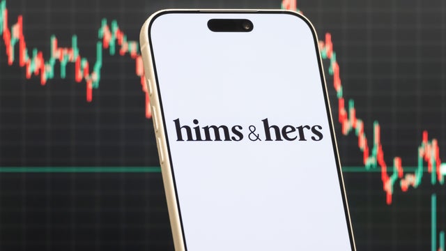 Hims & Hers Logo Shown on Smartphone with Latest Stock Market Chart 