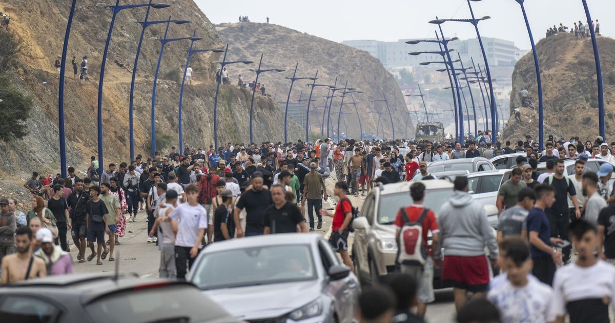 Stunning video shows migrants crossing Spain's border with Morocco