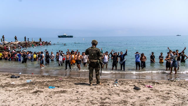 Hundreds Of People Are Swimming Across To Ceuta From Morocco 