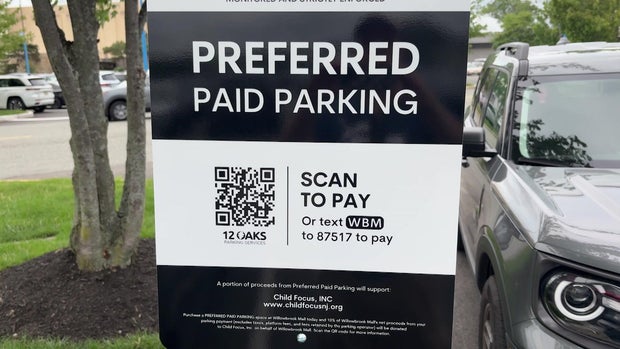 Preferred paid parking sign